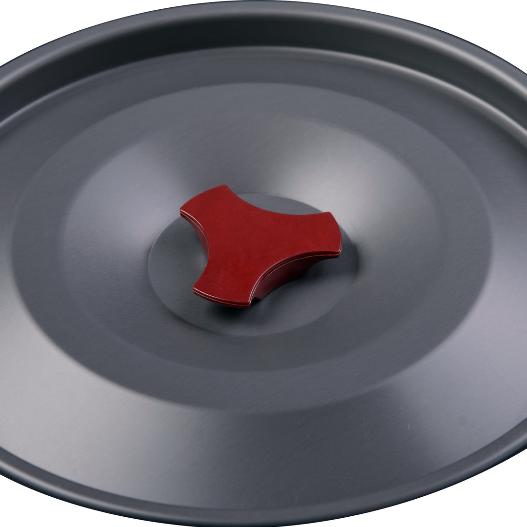 Close-up detail of the Aluminum Alloy Hanging Pot lid, showcasing the durable handle and secure fit designed to maximize rapid heating efficiency and prevent heat loss during camp cooking.