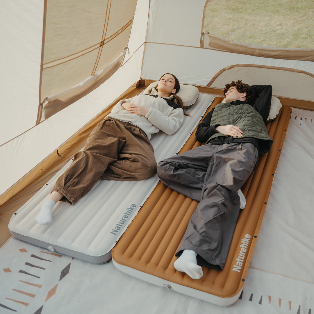 Two Libamboo Modular Inflatable Pads connected together, one in Grey and one in Caramel, showing a comfortable setup for two people. Ideal for camping, hiking, backpacking, and outdoor adventures.