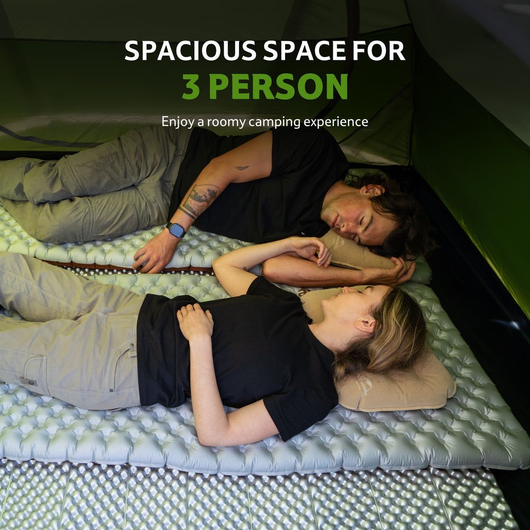 Bleik 3-Person Backpacking Tent in green shown with two people sleeping inside, highlighting the spacious interior and comfortable layout that allows campers to enjoy a roomy camping experience.