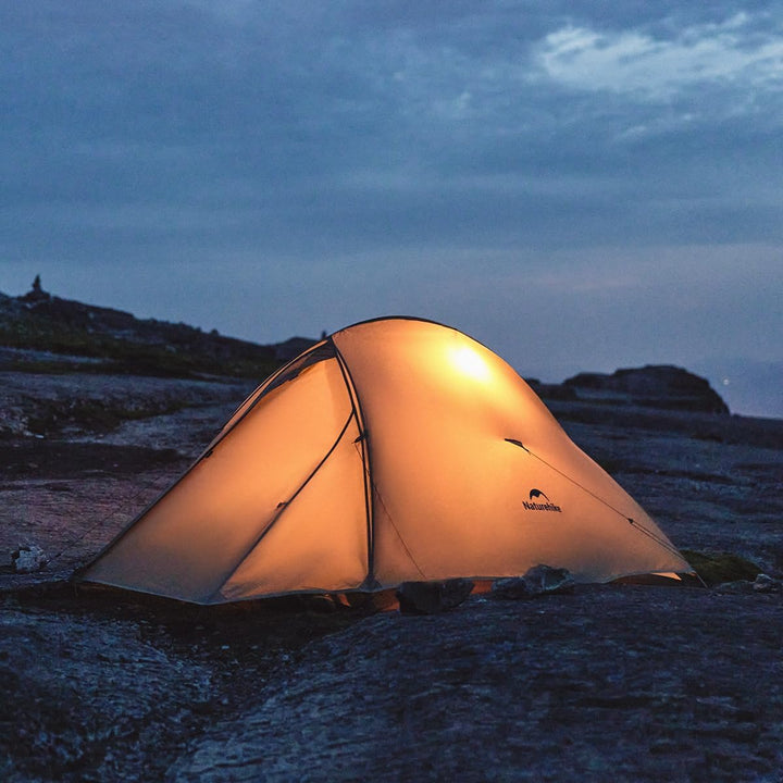Naturehike Cloud Up Pro 2-Person Ultralight Backpacking Tent illuminated at night in the outdoors, highlighting its lightweight, durable, and weatherproof design—perfect for hiking, trekking, and backpacking adventures.