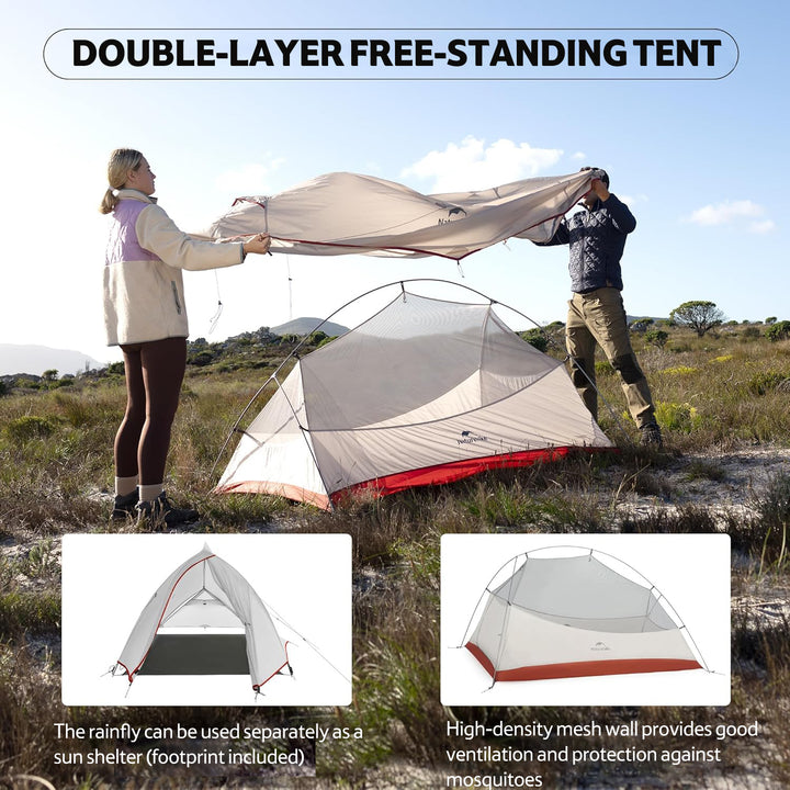 Two people assembling the outer flysheet of the Naturehike Cloud Up Pro 2-Person ultralight backpacking tent on a grass field, showing the inner tent already set up, waterproof and wind-resistant shelter for camping and hiking.