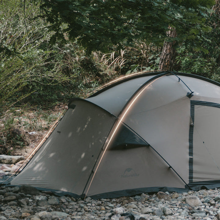Naturehike Massif 2-Person Hot Tent set up outdoors, highlighting its innovative tent structure, aerodynamic rear design, and modern four-season camping features, perfect for motorcycle touring and adventure camping.