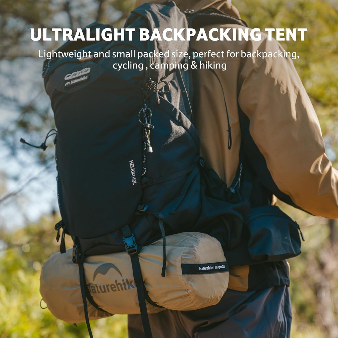 Hiker carrying a backpack with compact and ultralight Naturehike Mongar UL 2 men tent attached, ideal for backpacking, hiking, and cycling trips, small and easy to carry.